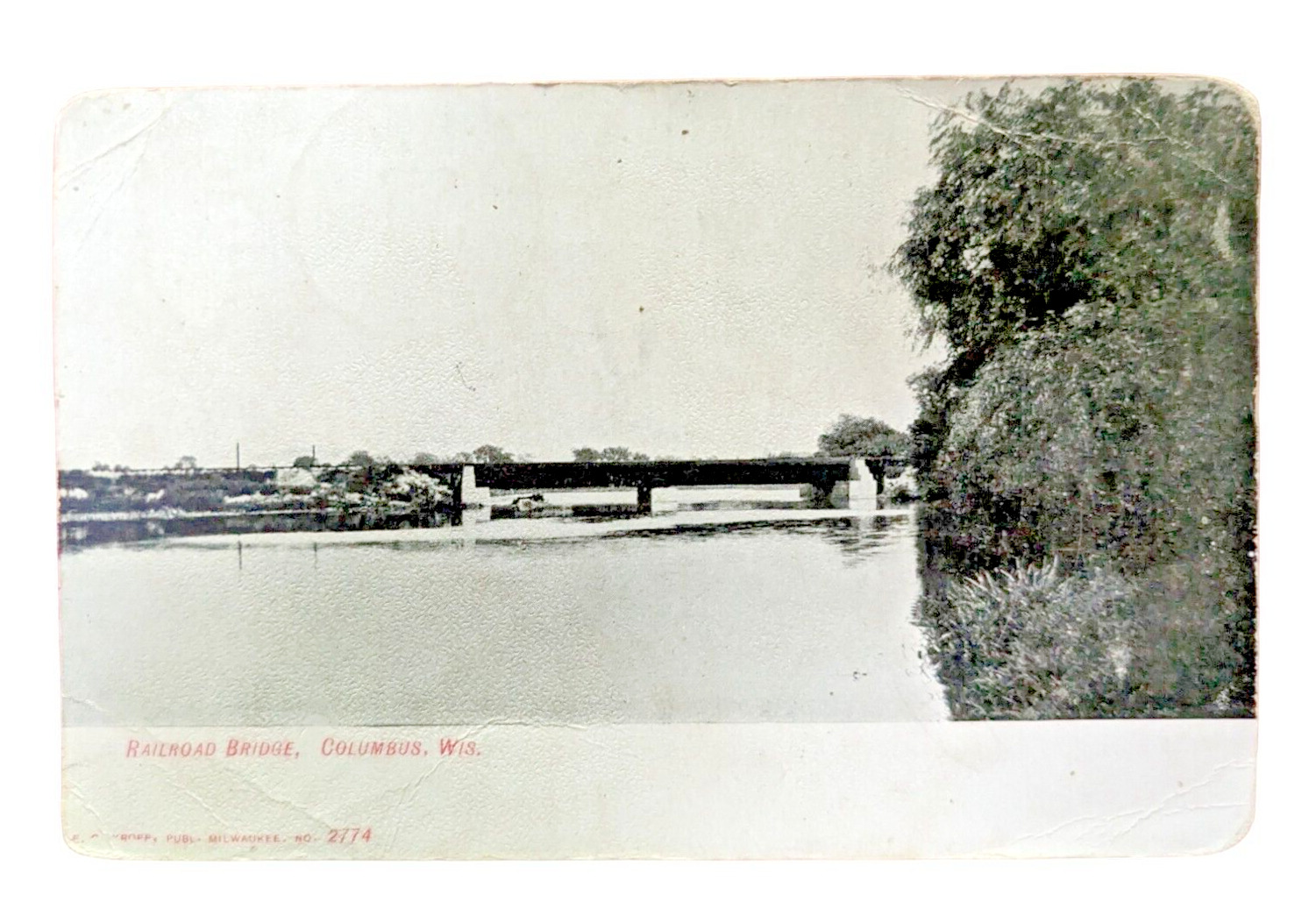 1909 Lithograph Postcard - Columbus WI - Railroad Bridge - E C Kropp Eagle Logo