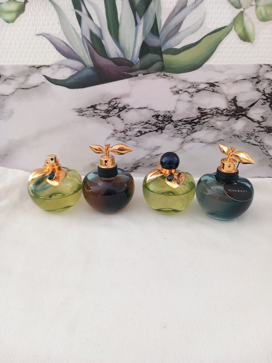 4 Nina Ricci Perfume Bottles