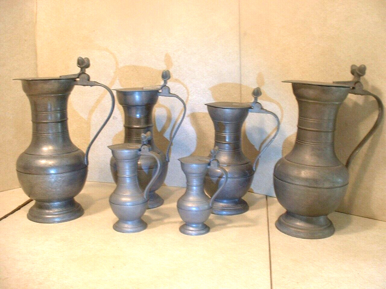 6 Antique Graduated French Pewter Flagons with Acorn Thumb Grips W/Touchmarks