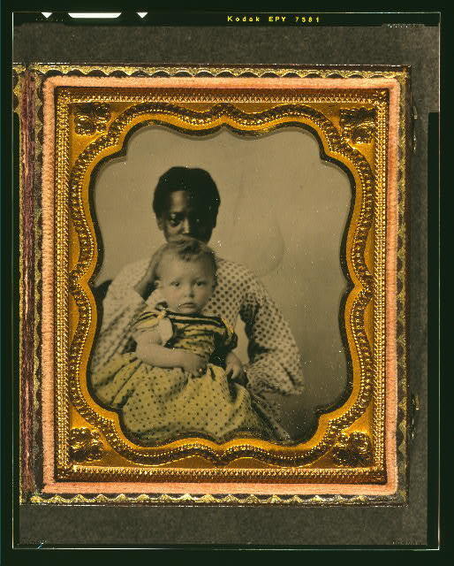 Photo:African American woman holding a white child,c1855