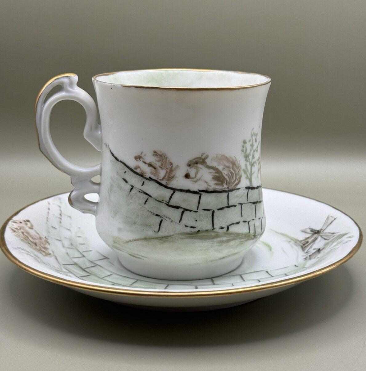 Handpainted Antique Porcelain Mustache Cup & Saucer Squirrel Windmill Gold Trim