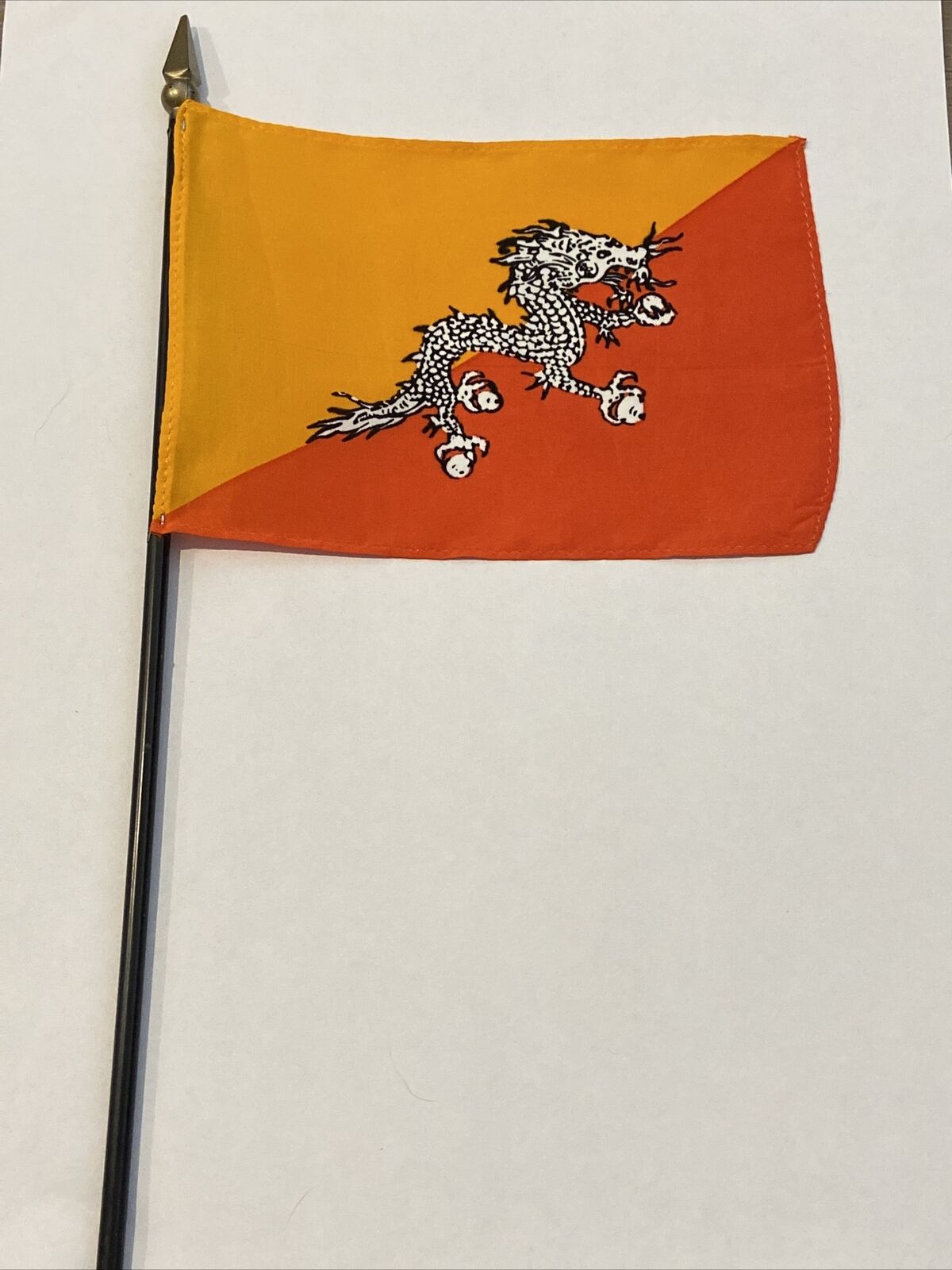 New Bhutan Mini Desk Flag - Black Wood Stick Gold Top 4” X 6”