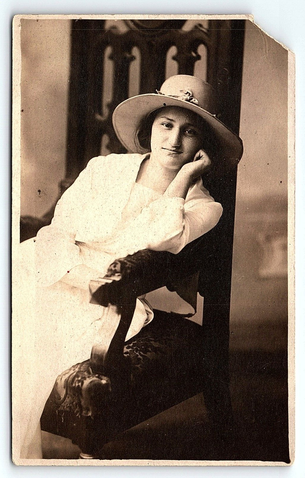 c1910 YOUNG LADY WITH HAT IN GIANT CHAIR STUDIO PHOTOGRAPH RPPC POSTCARD P4278
