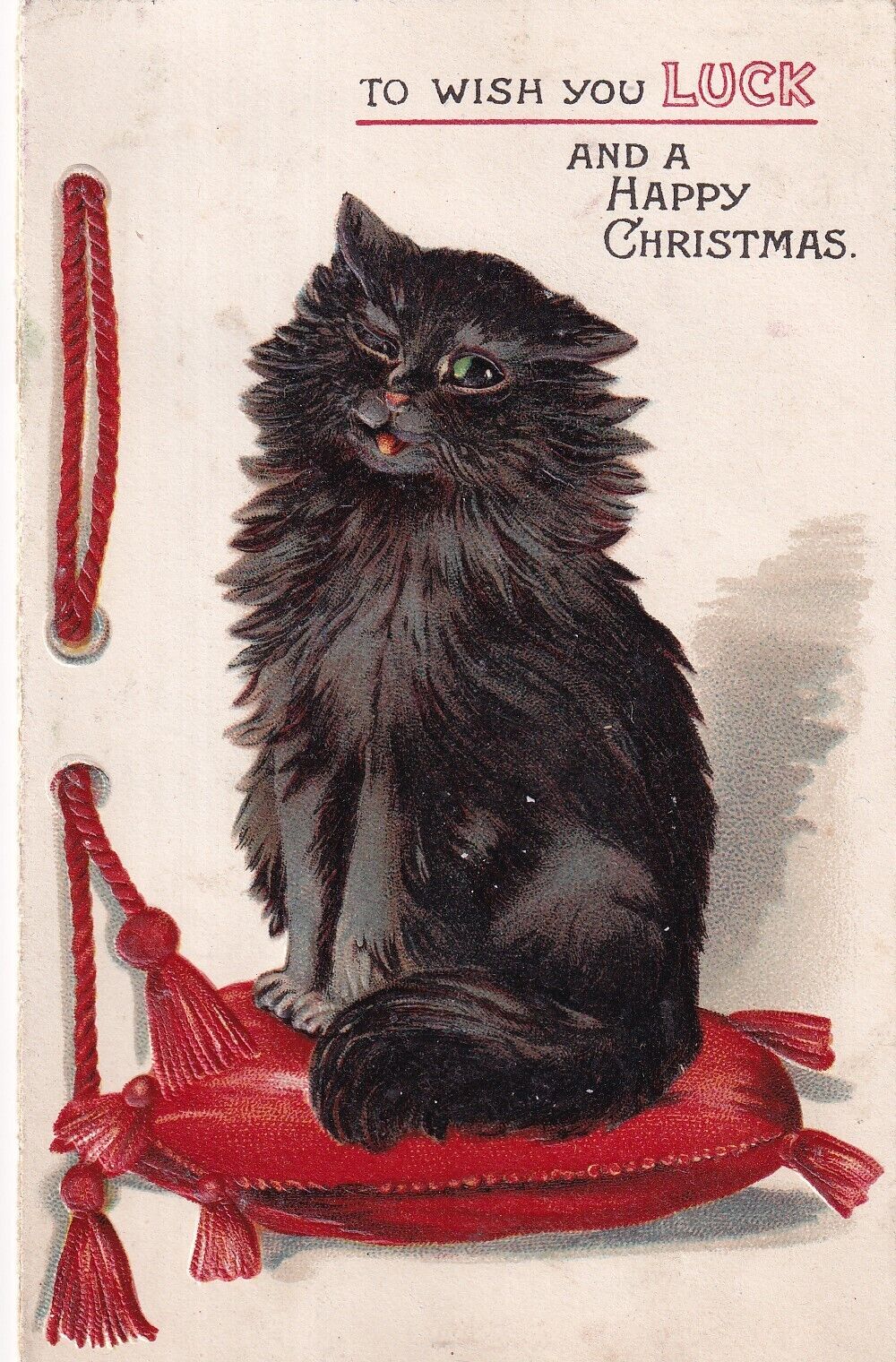Black cat sits on red cushion, Louis Wain ?, Christmas greeting