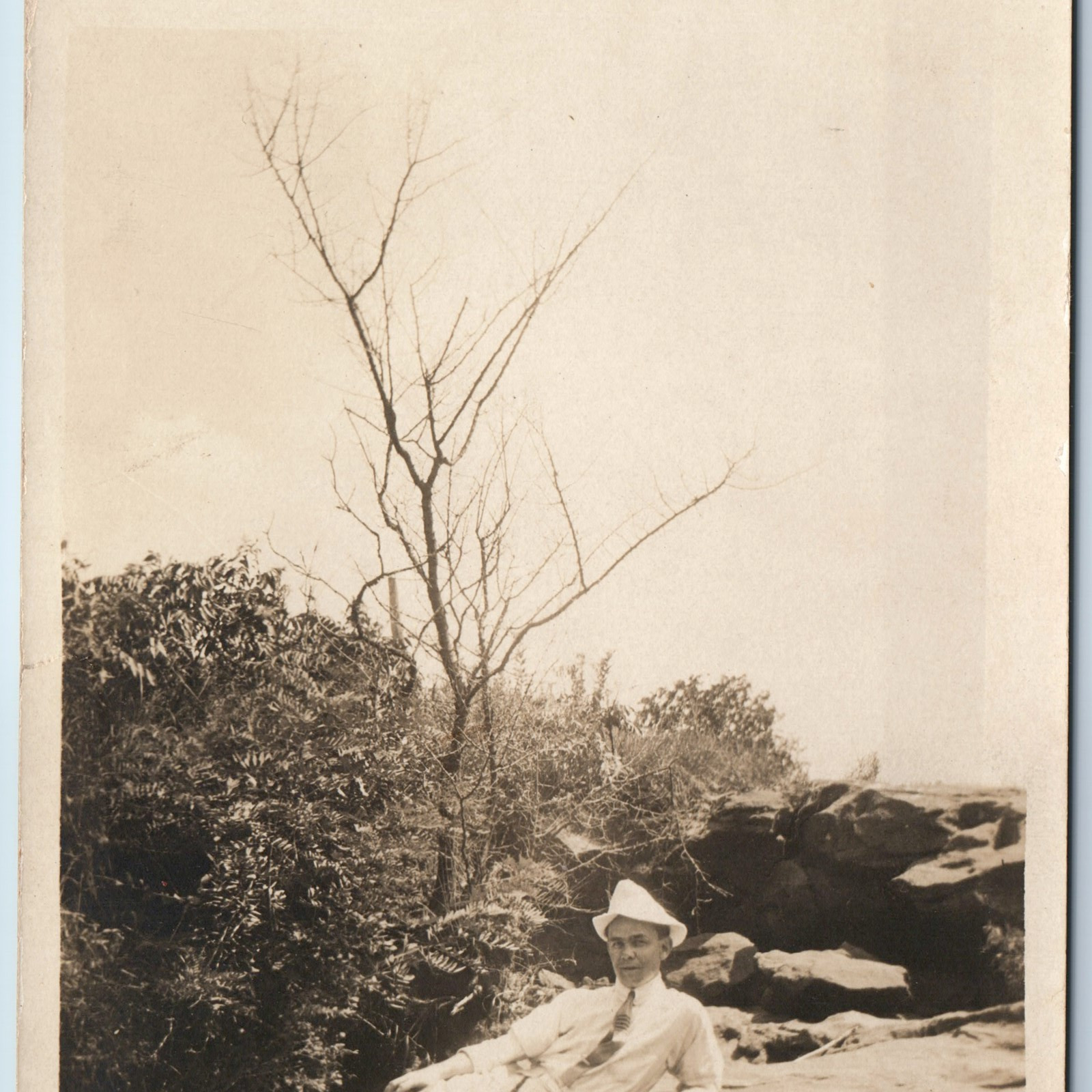 c1910s Classy Cool RPPC Outdoor Relaxing on Rock in Sun Real Photo Postcard A211