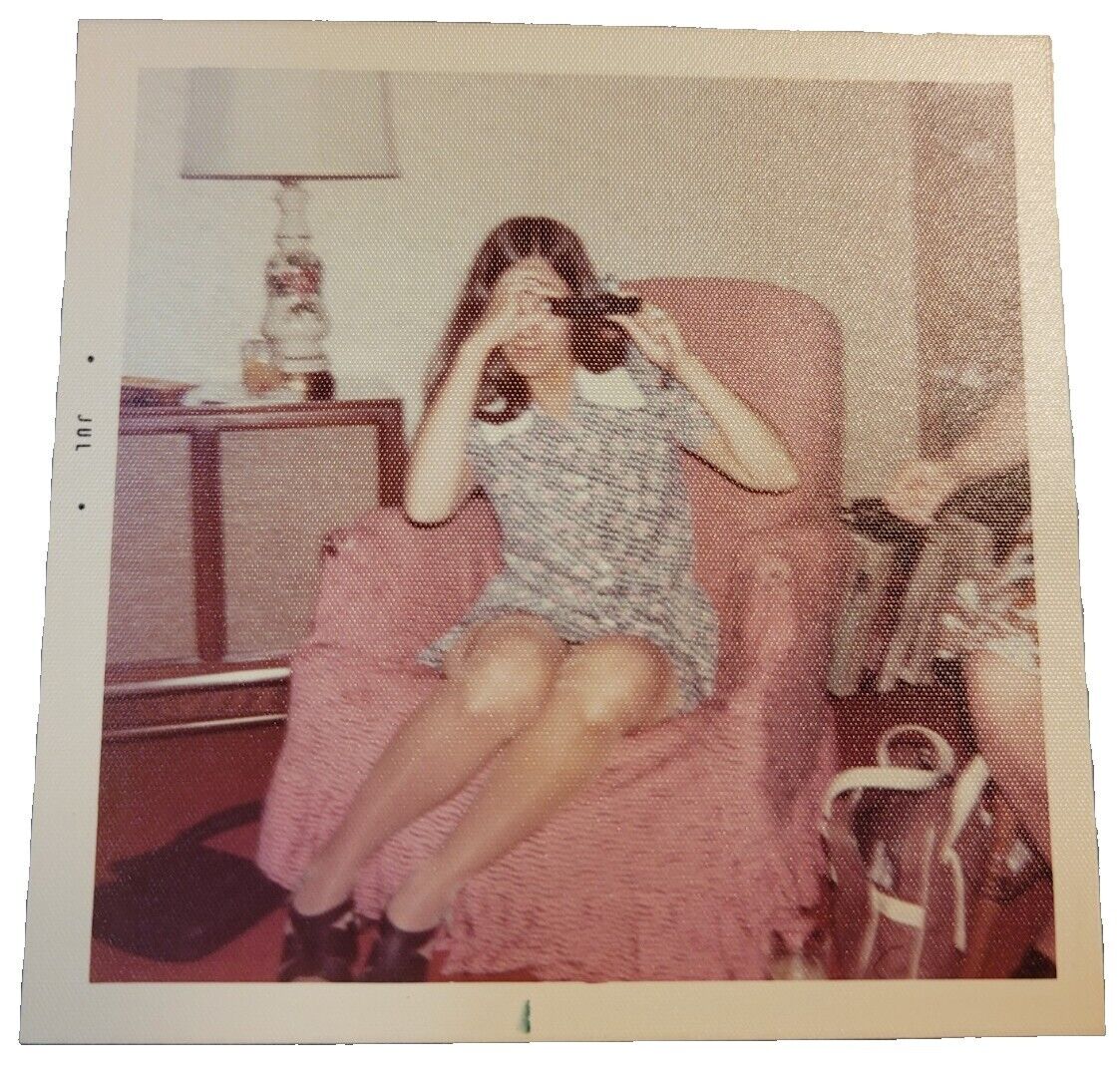 1970s American Teen Girl Sitting in Chair using Camera Photo Color Vtg Snapshot