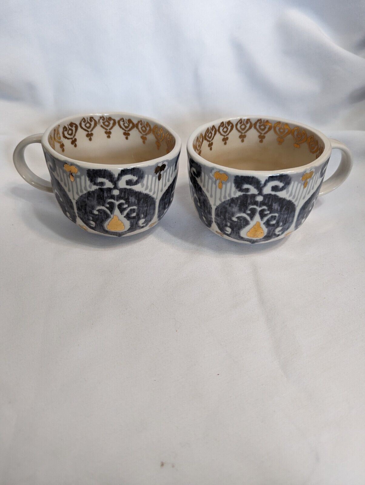 Pair of Anthropologie Tanja Gray Gold Ikat pattern mugs - please read