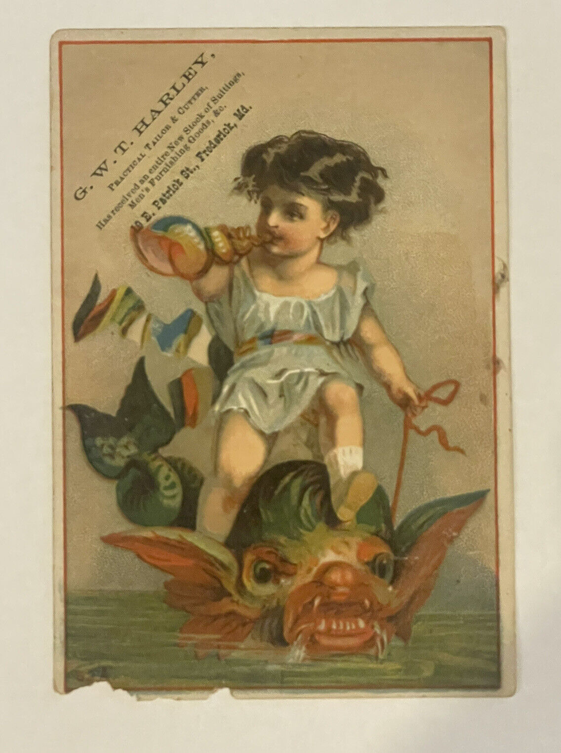 1890s Girl Riding Fish- G.W.T Harley Tailor & Cutter Frederick,MD Trade Card