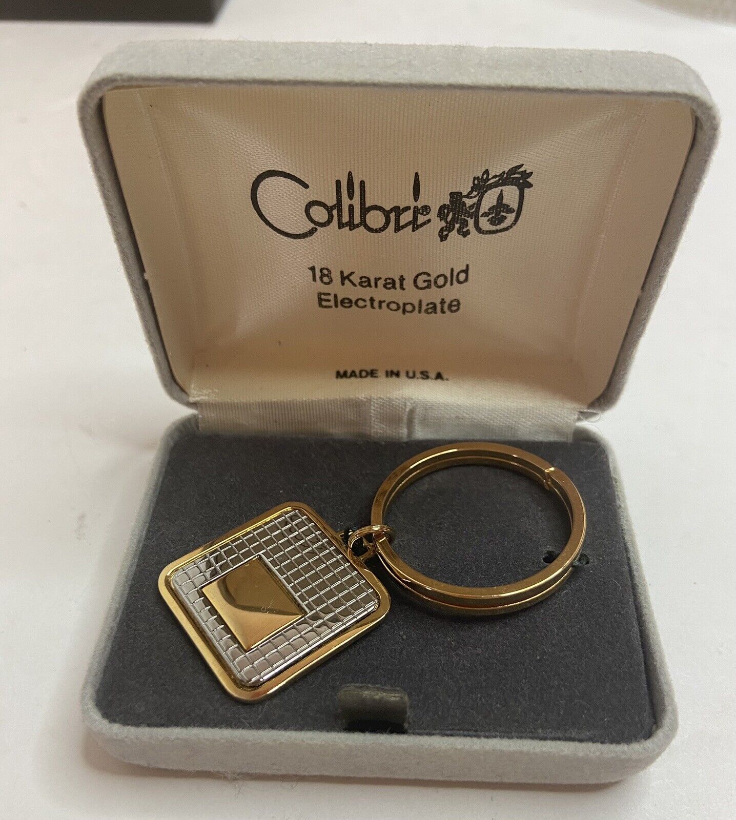 VINTAGE COLIBRI 18 KARAT GOLD ELECTROPLATE KEYCHAIN KEY CHAIN RING IN BOX USA