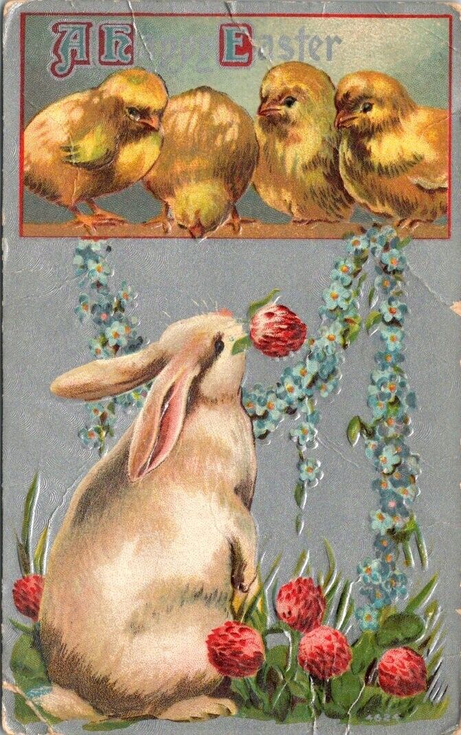 vintage postcard- A happy easter- chicks and bunny with flowers embossed 1910