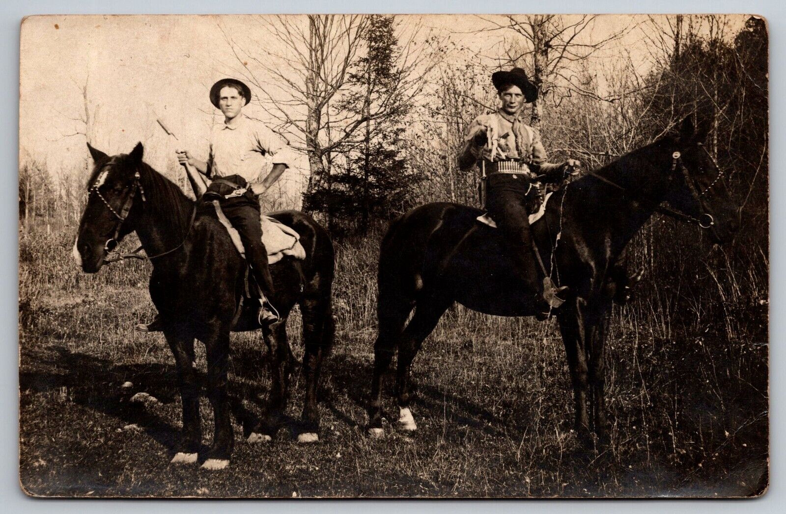 PostCard RPPC Cowboys horses Guns bullets belt early America | c1910s