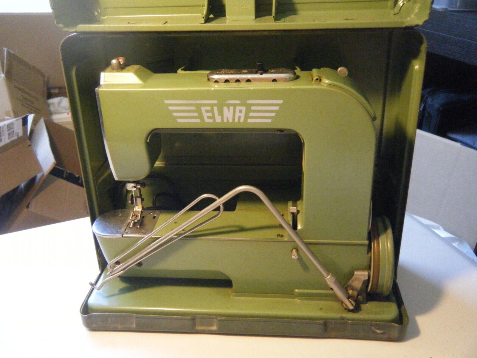 Vintage Elna Swiss Grasshopper sewing machine with metal carrying case