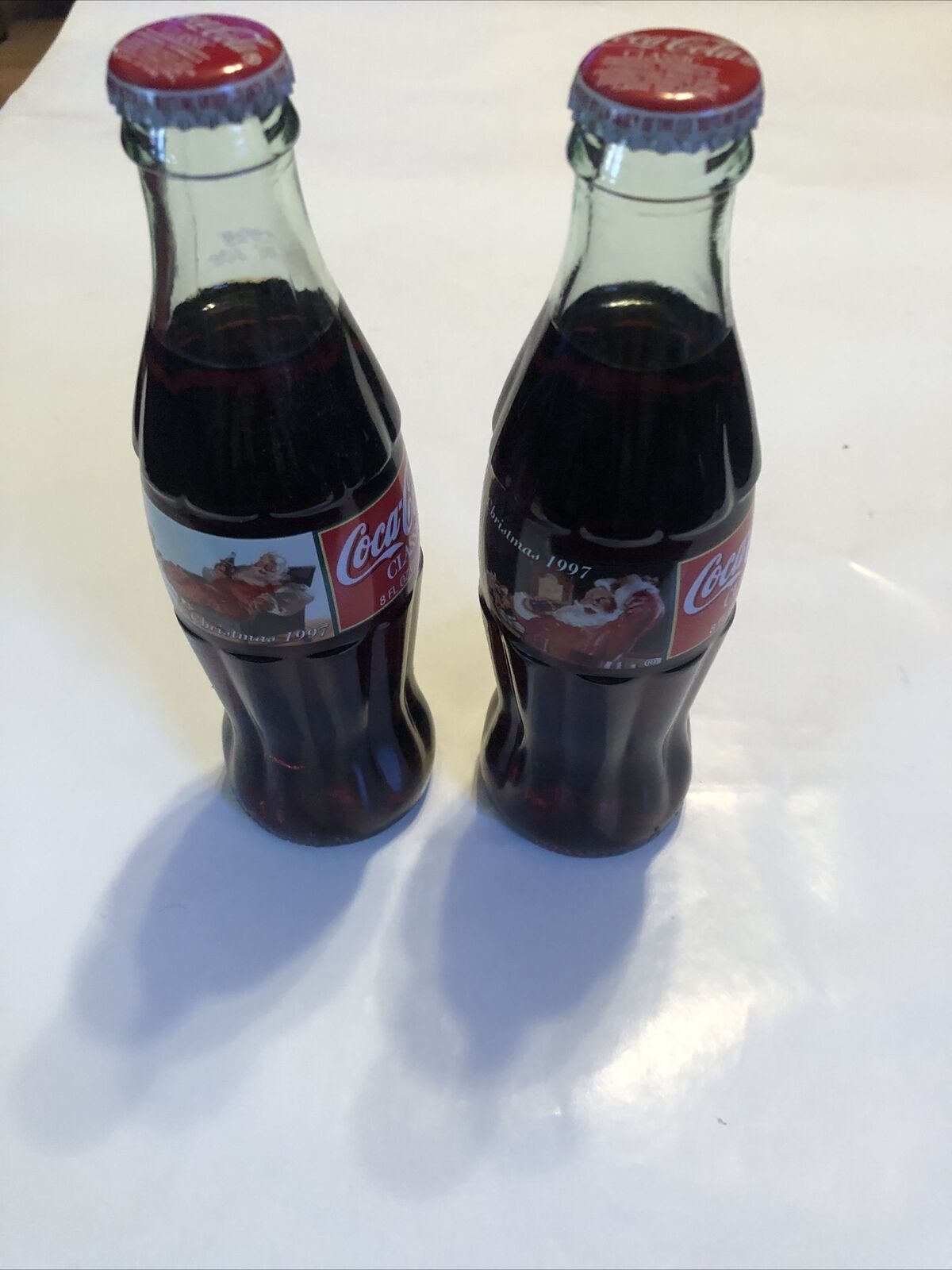 2 Vintage 1997 Christmas ￼Coca Cola Classic Coke 8oz Full Bottles Santa Claus