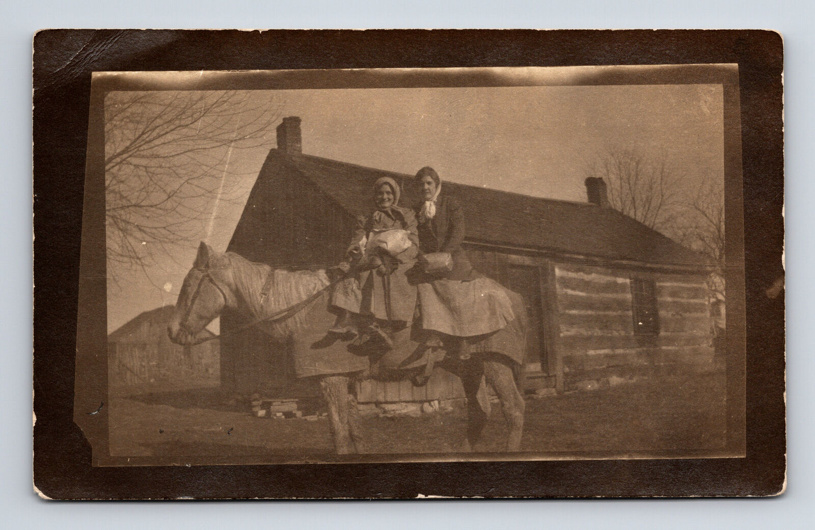 RPPC Two Woman Riding Side Saddle on Horse Log Cabin Fann Noel & Nalla Postcard