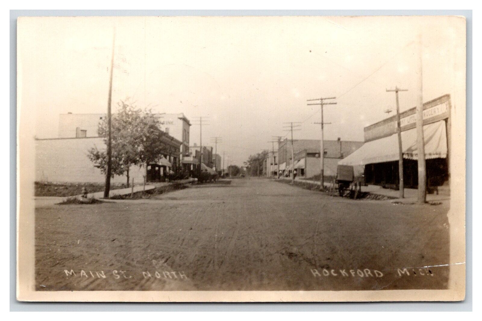 ROCKFORD MICHIGAN MI ~ Main street North ~ 1912 RPPC Kent County DIRT ROAD