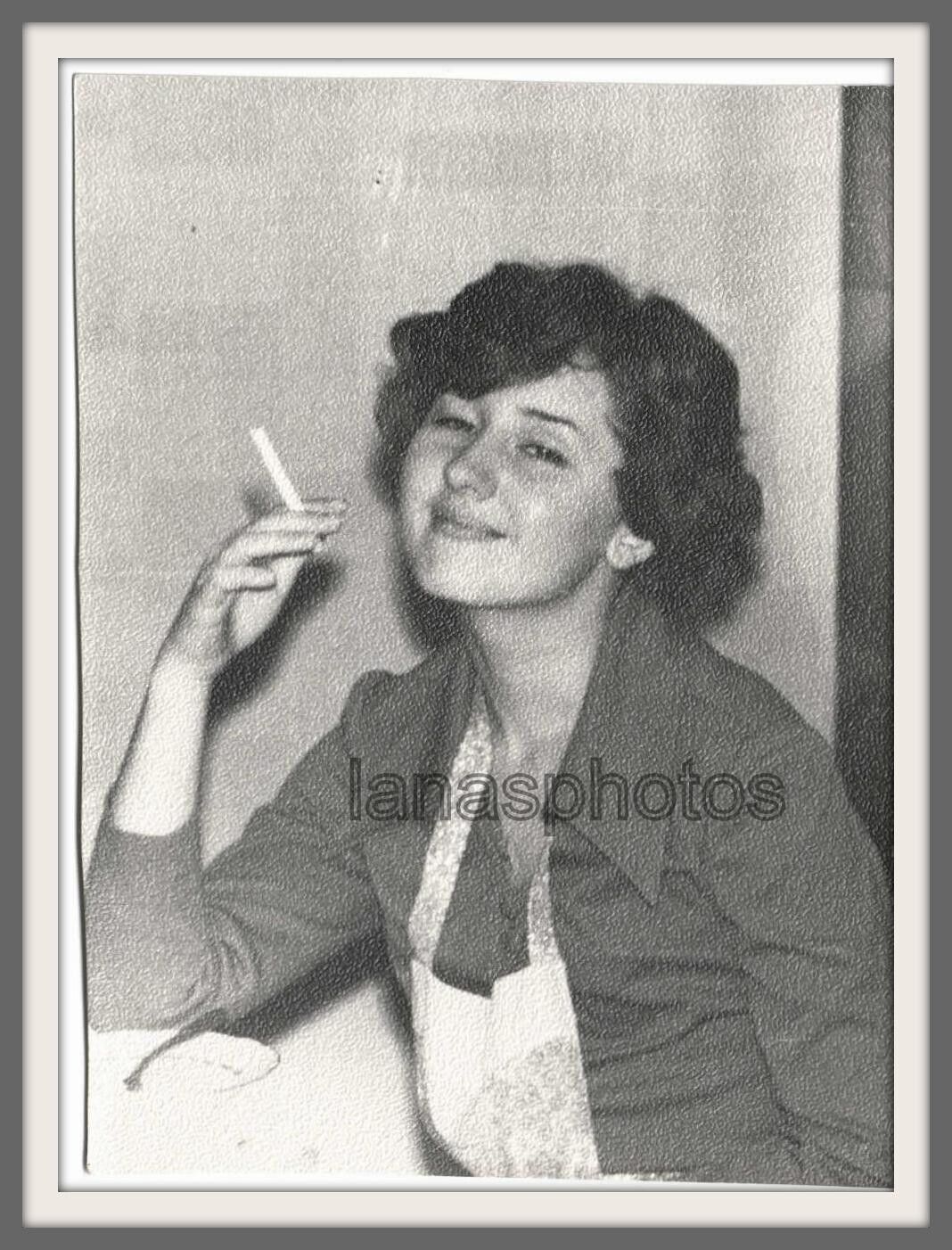 1960 Beautiful girl pretty young woman Stylishly smoking cigarette vintage photo