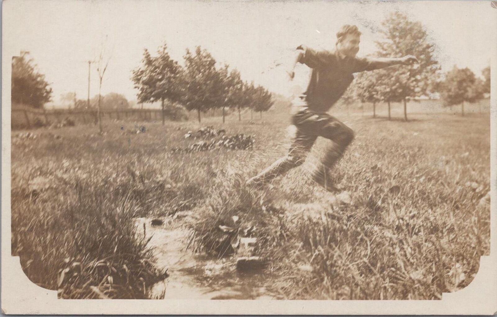 RPPC Postcard Man Running in a Field 