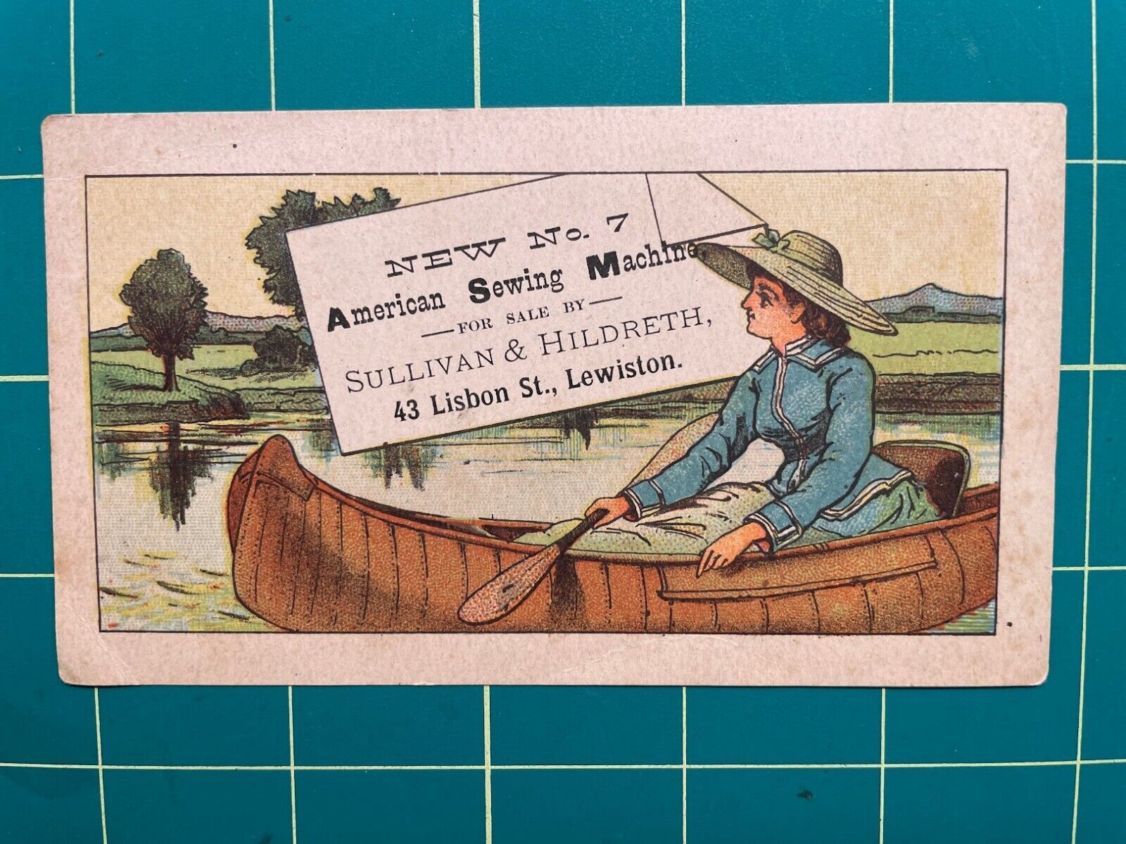 American Sewing Machine trade card - woman in canoe - Lewiston, ME
