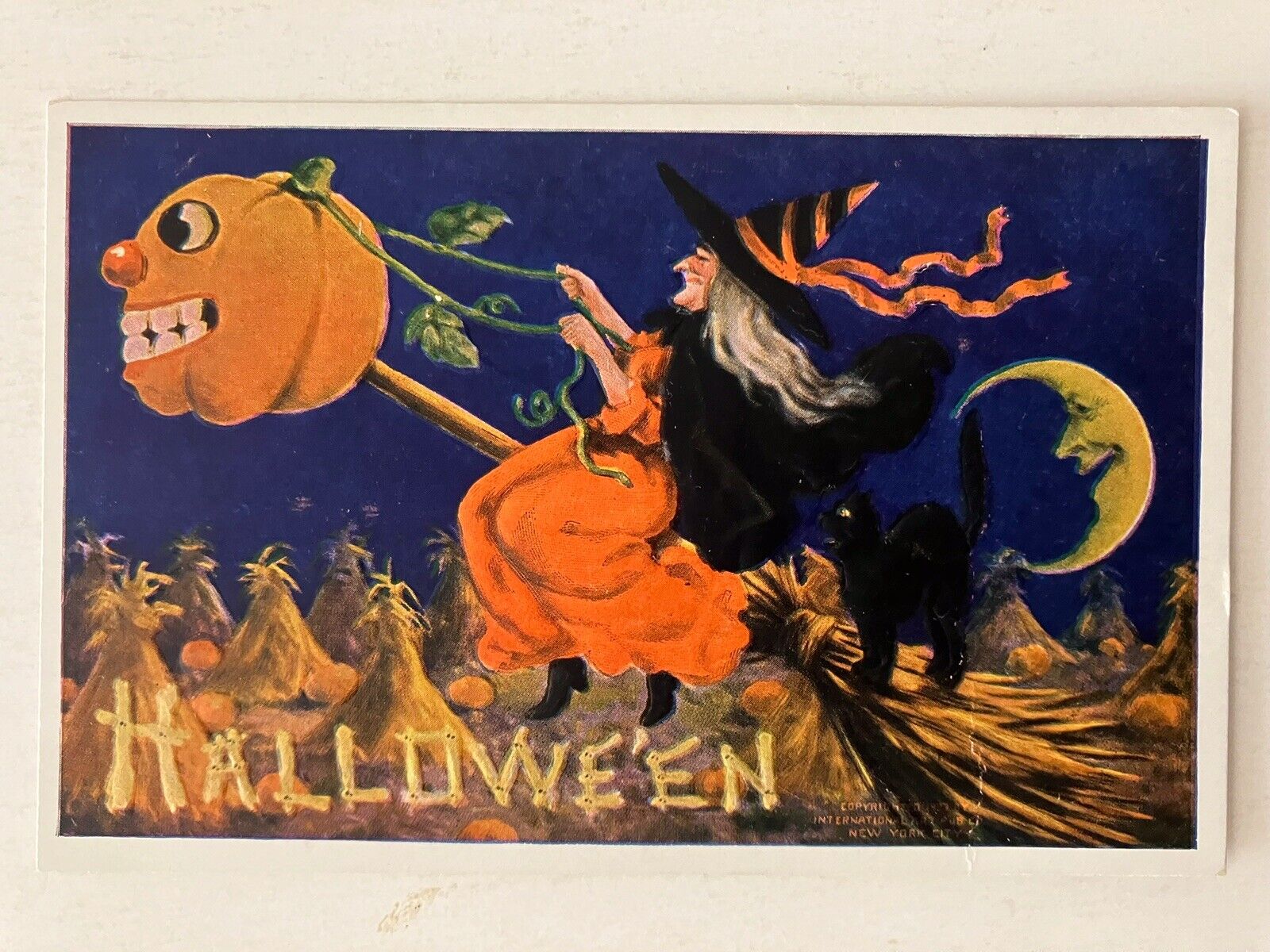 c1909 Intl Art Halloween Postcard Witch And Black Cat Riding On JOL Broom