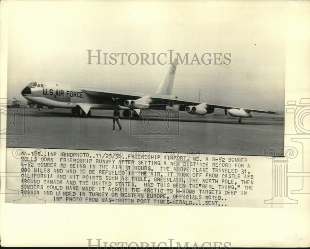 1956 Press Photo Man & USAF B-52 bomber at Friendship Airport runway in Maryland