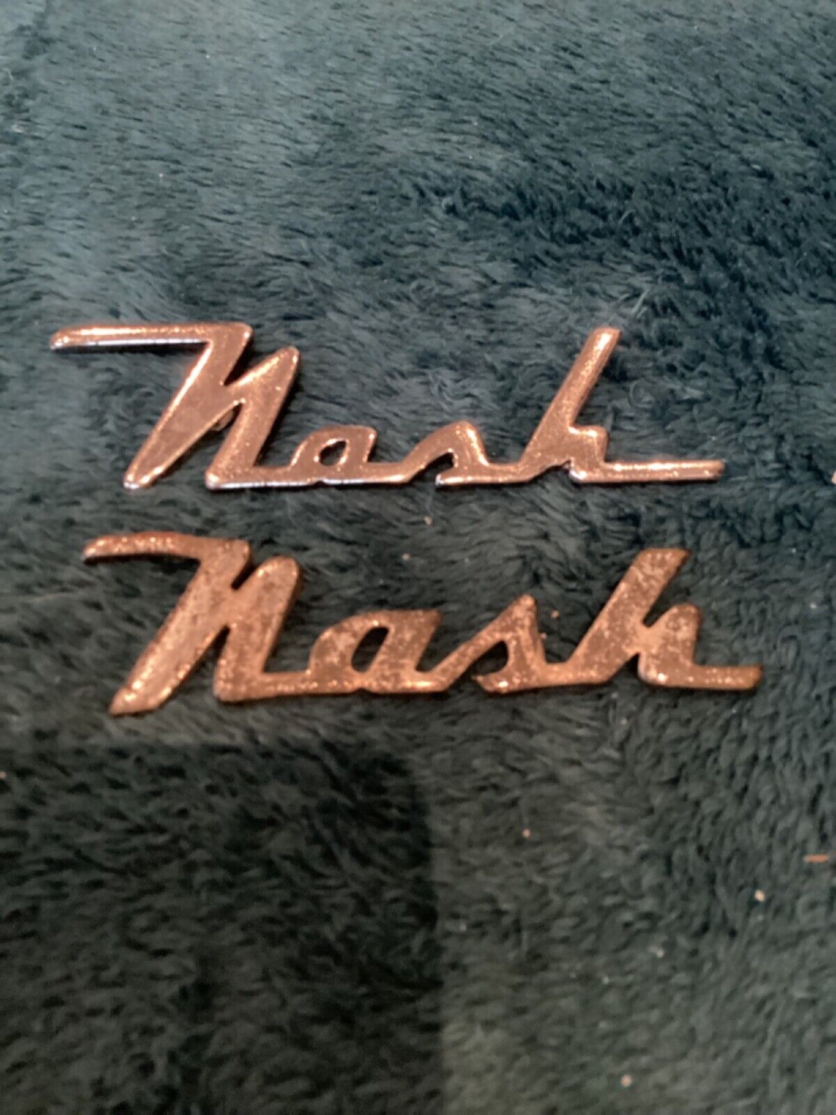 Two Vintage Nash Emblems