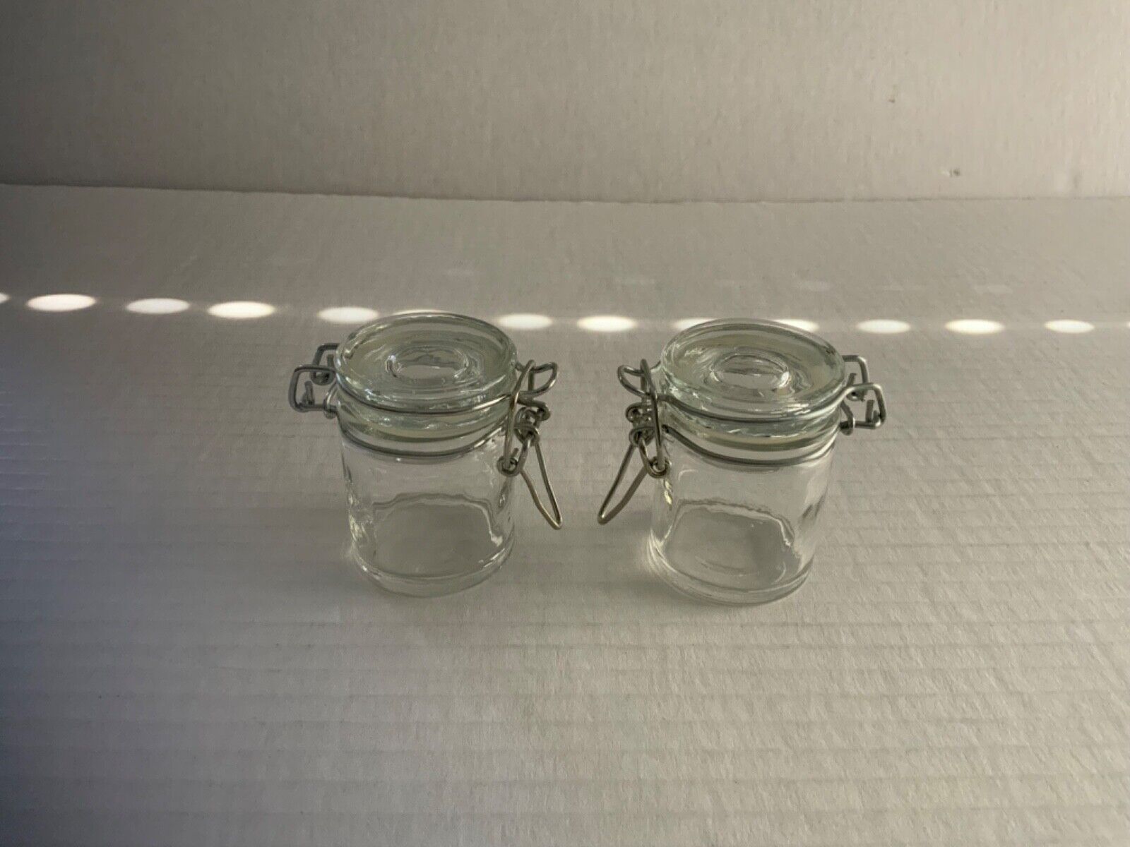PAIR OF MINI JAM/JELLY JARS WITH METAL BANDED ATTACHED LOCKING LID AND GASKET