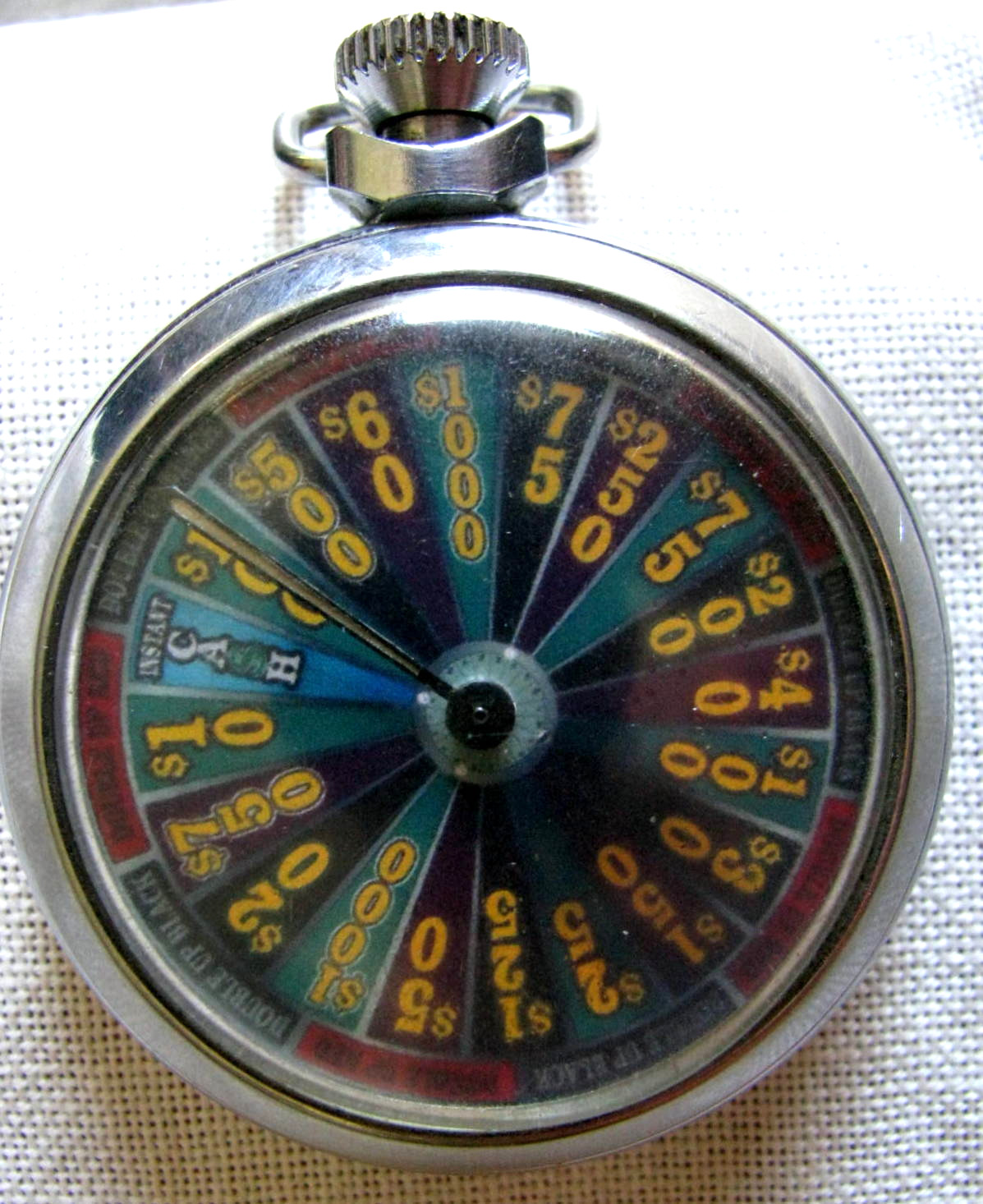 FINE VINTAGE POCKET STYLE $10 TO $1,000 DENOMINATION MECHANICAL GAMBLING DEVICE