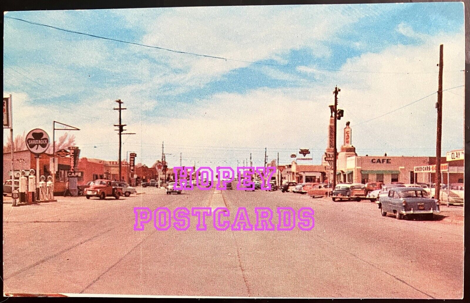 ROUTE 66~SHAMROCK, TX~VIEW OF HWY 66 THRU TOWN~GAS PUMPS~vtg cars~postcard~1950s