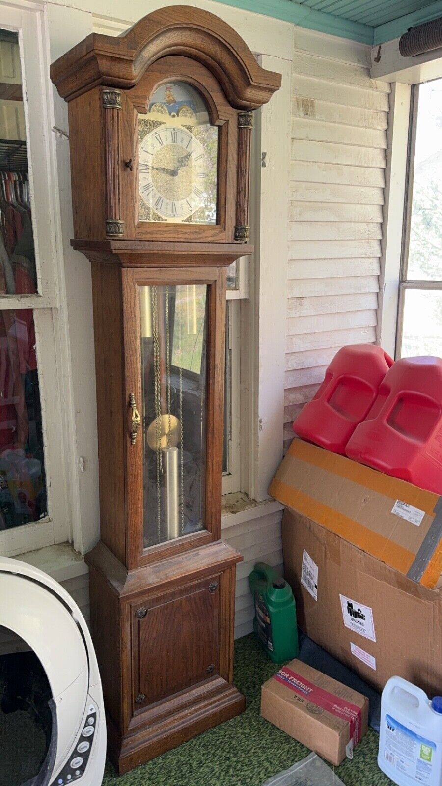antique brown and gold grandfather clock in good condition 