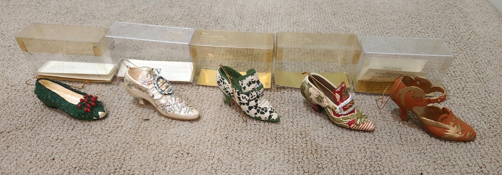 Collection of five Metropolitan Museum of Art Shoe Ornaments