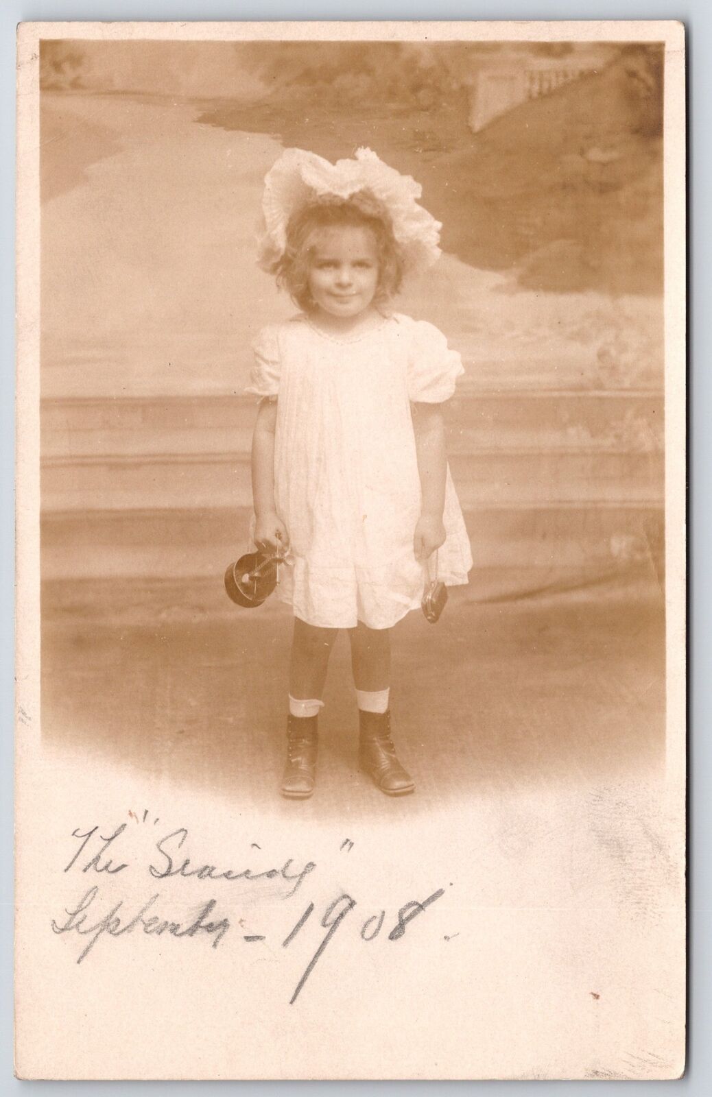 1908 Young Girl Photo Holding A Bottle Smiley Face Antique Posted Postcard