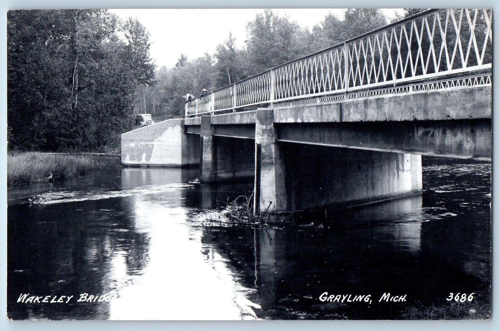 Grayling Michigan MI Postcard RPPC Photo Wakeley Bridge Car People Scene c1940's