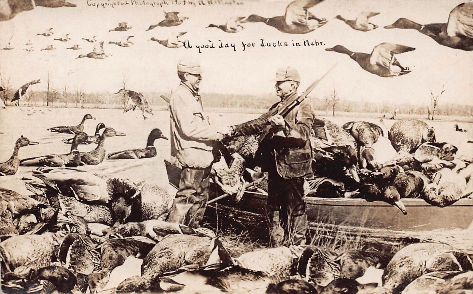 1909 Nebraska NE Good Day Duck Hunting Exaggeration Rifle RPPC Postcard
