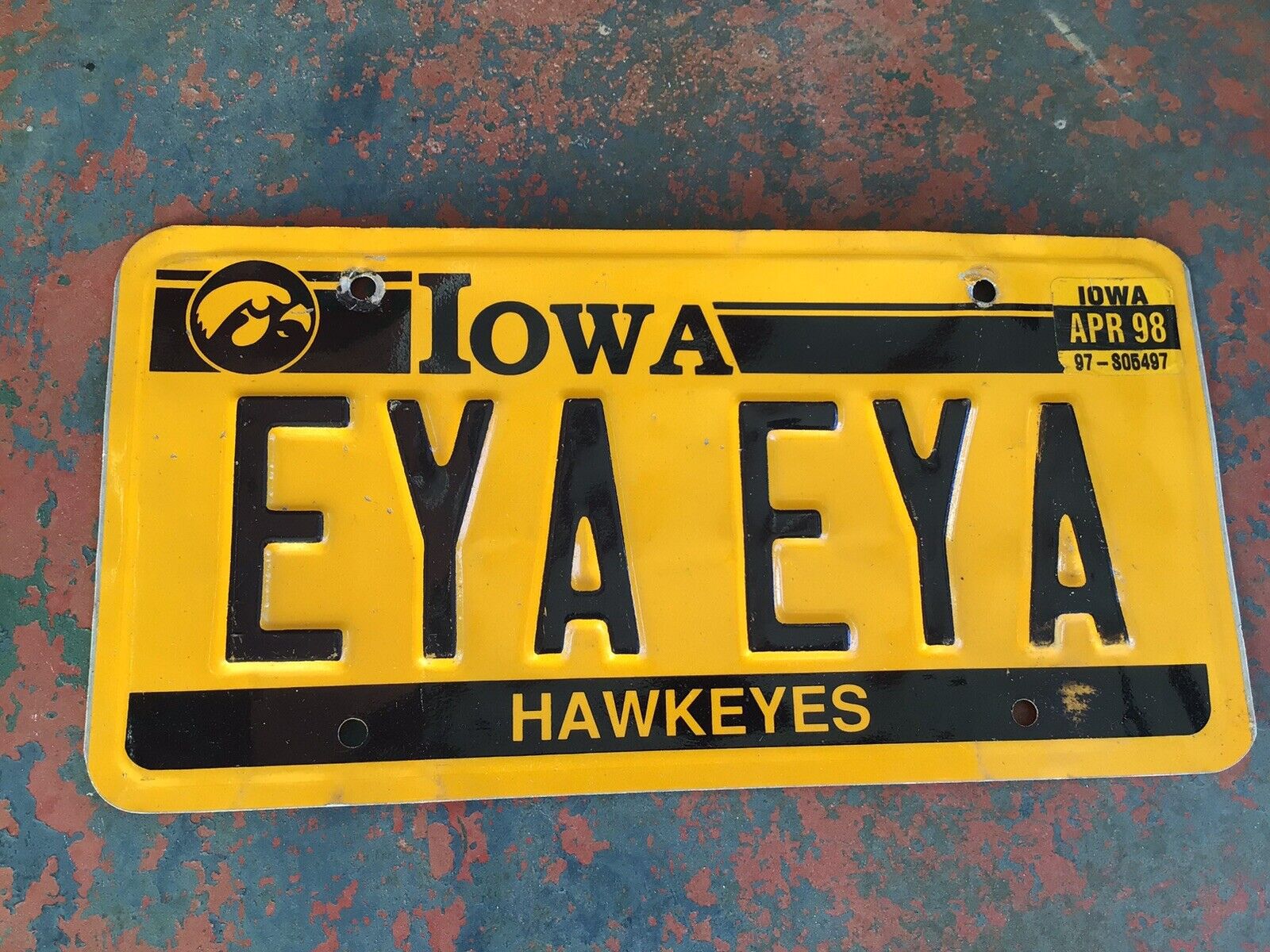 IOWA HAWKEYES BOOSTER LICENSE PLATE: EYA EYA Iowa Hawkeyes Football (metal)
