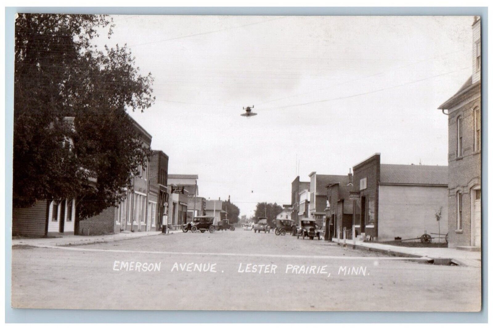 Lester Prairie Minnesota MN RPPC Photo Postcard Emerson Avenue Cars Scene c1930s