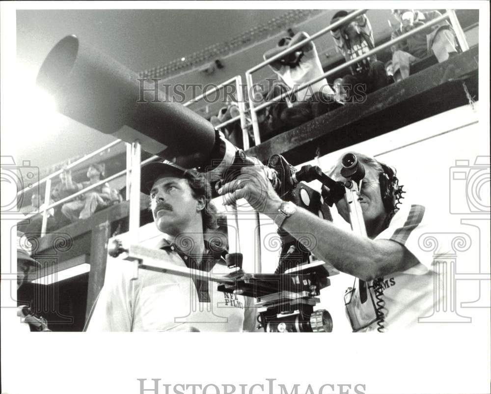 1989 Press Photo Filmmakers for the NFL feature at work during a game