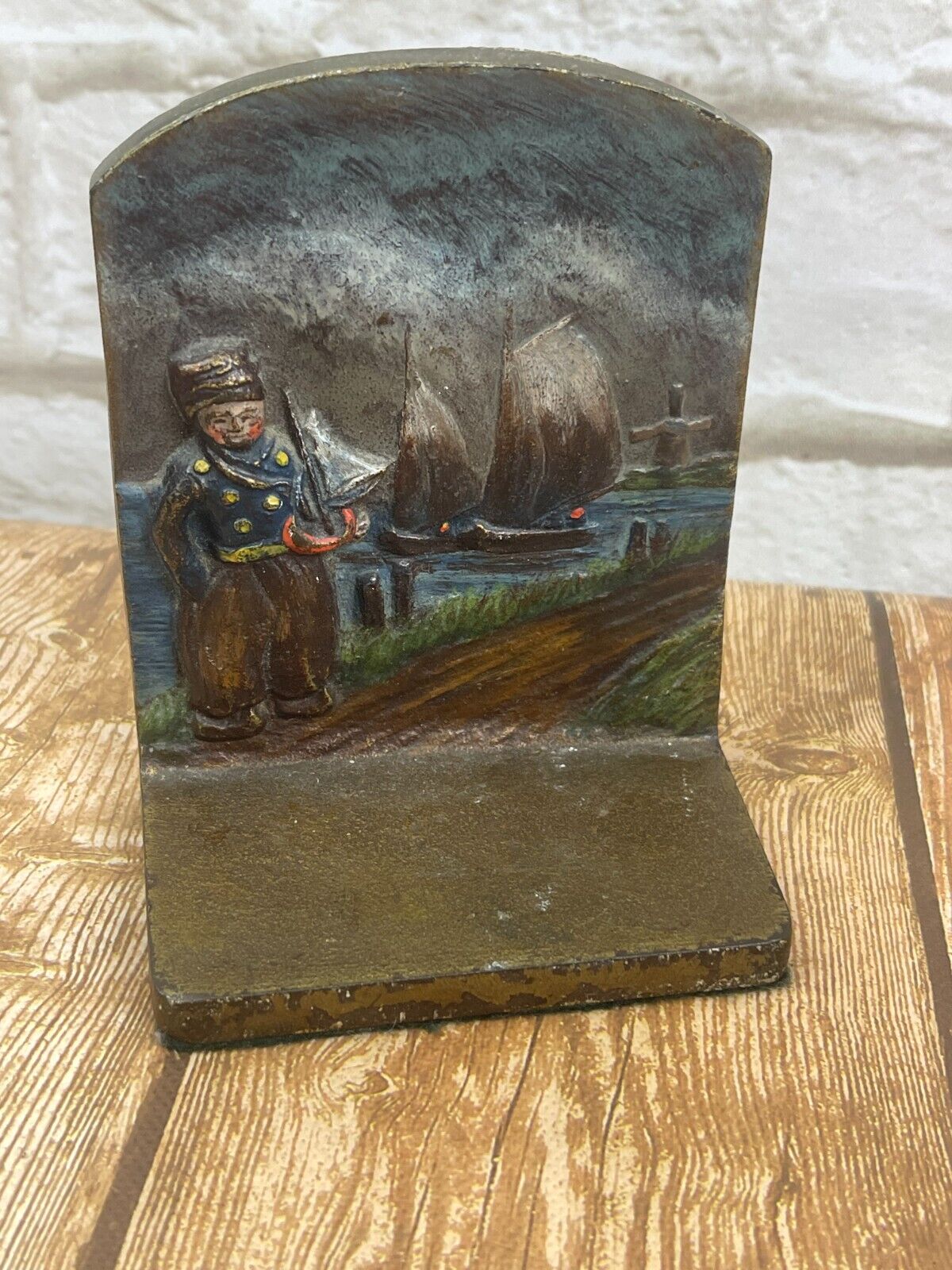 Vintage single bookend dutch child with sailboat