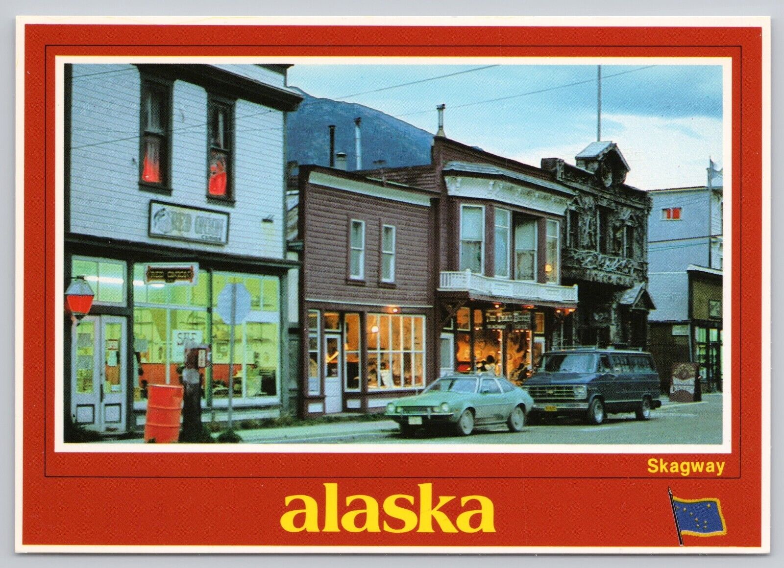 Skagway Alaska, Street View Old Cars Shops Lights at Dusk, Vintage Postcard