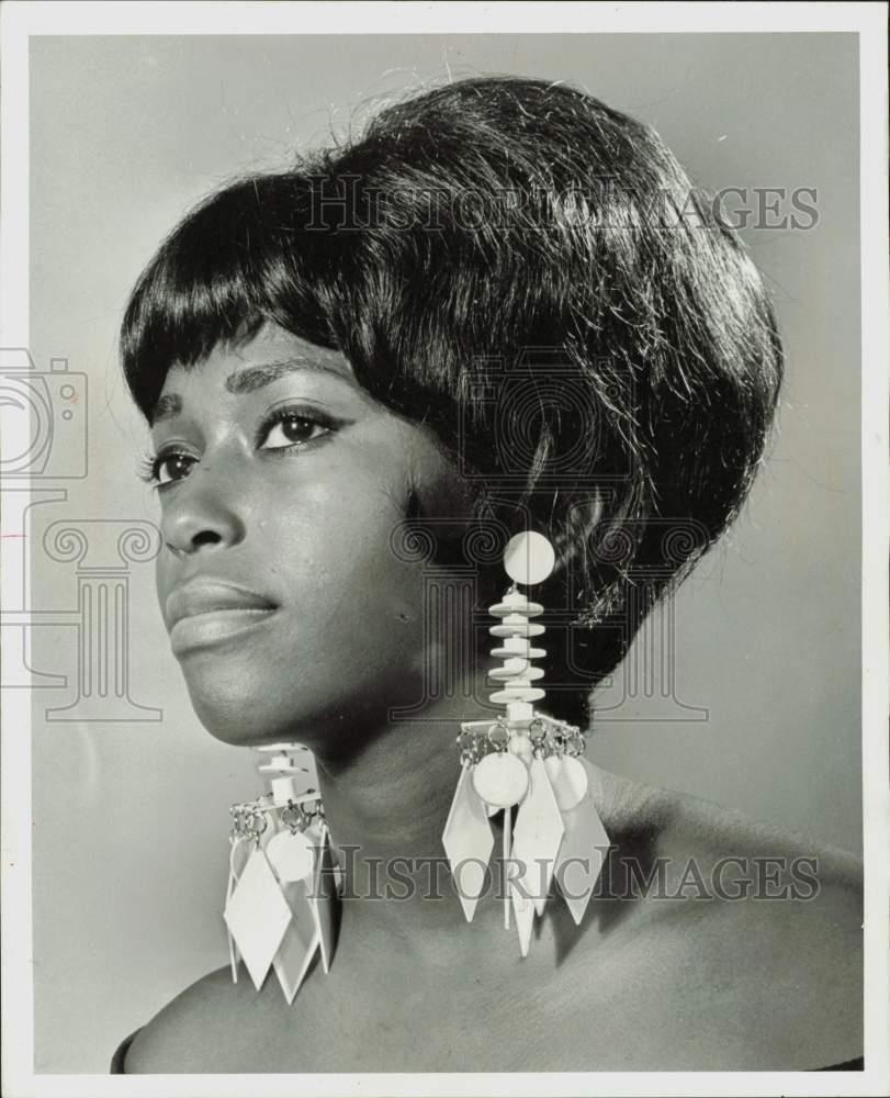 1966 Press Photo A model wearing Castlecraft earrings. - lra27164