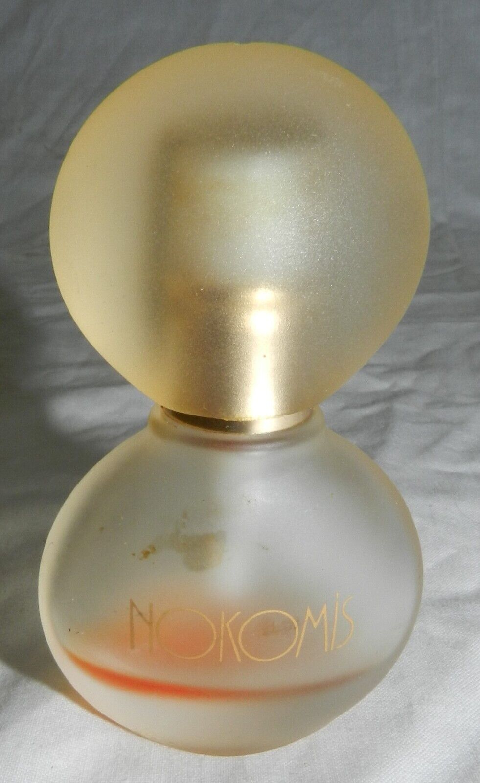 Nokomis by Coty Spray Perfume Bottle - 0.25 Fl. Oz. mostly empty