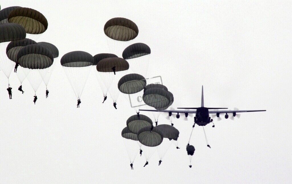 US Air Force (USAF) C-130 Hercules aircraft drops US Army (USA) Paratroopers