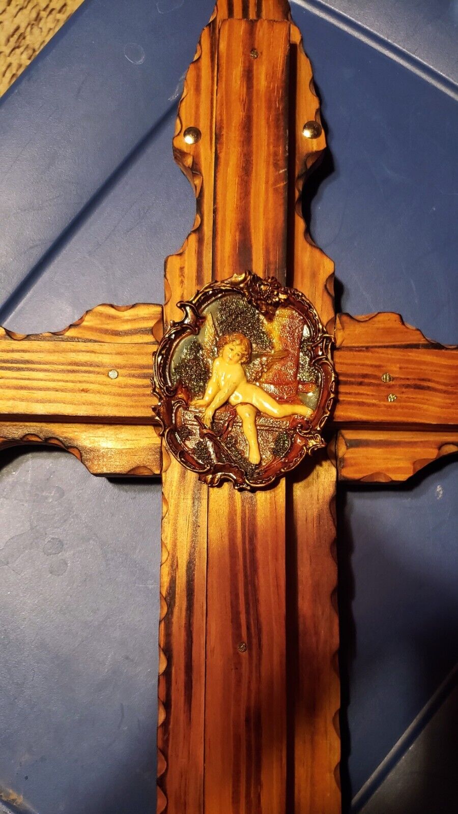 Handcrafted Large Cross With Child Angel Emblem Placed In Middle