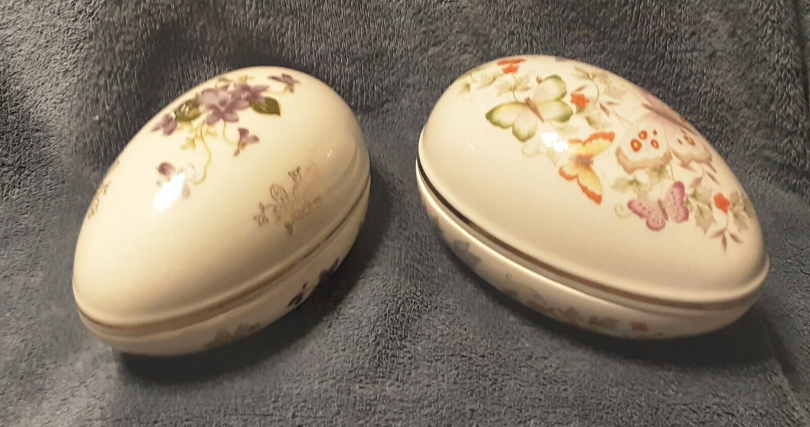 Pair of Vintage Porcelain Egg Trinket Boxes: 1 Lefton Violets, 1Avon Butterflies