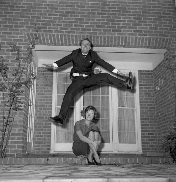 Popular television star Dickie Henderson takes leap joy over a- 1961 Old Photo