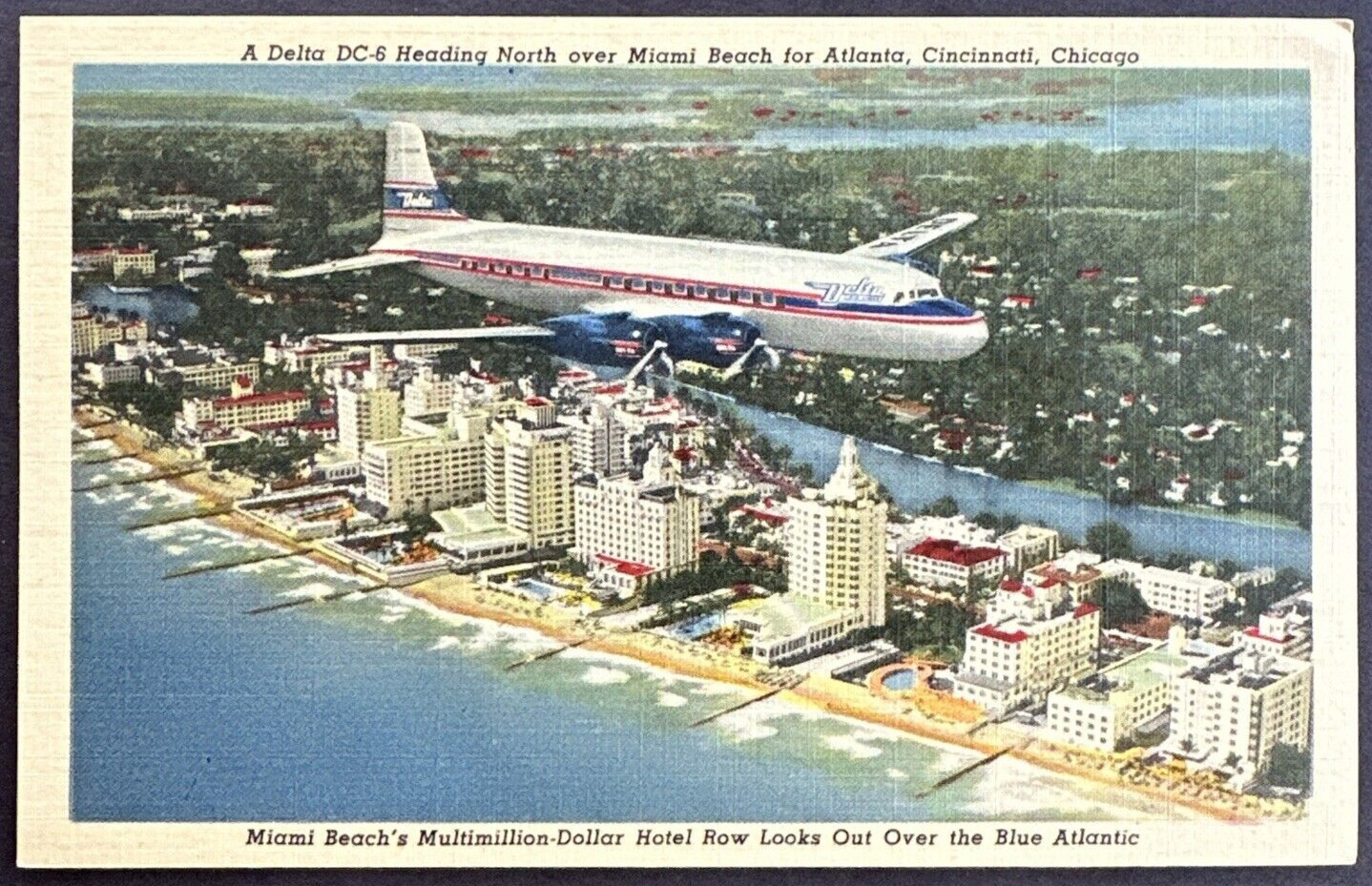 Postcard Delta Airlines DC-6 Heading North over Miami Beach for Atlanta & Cincy