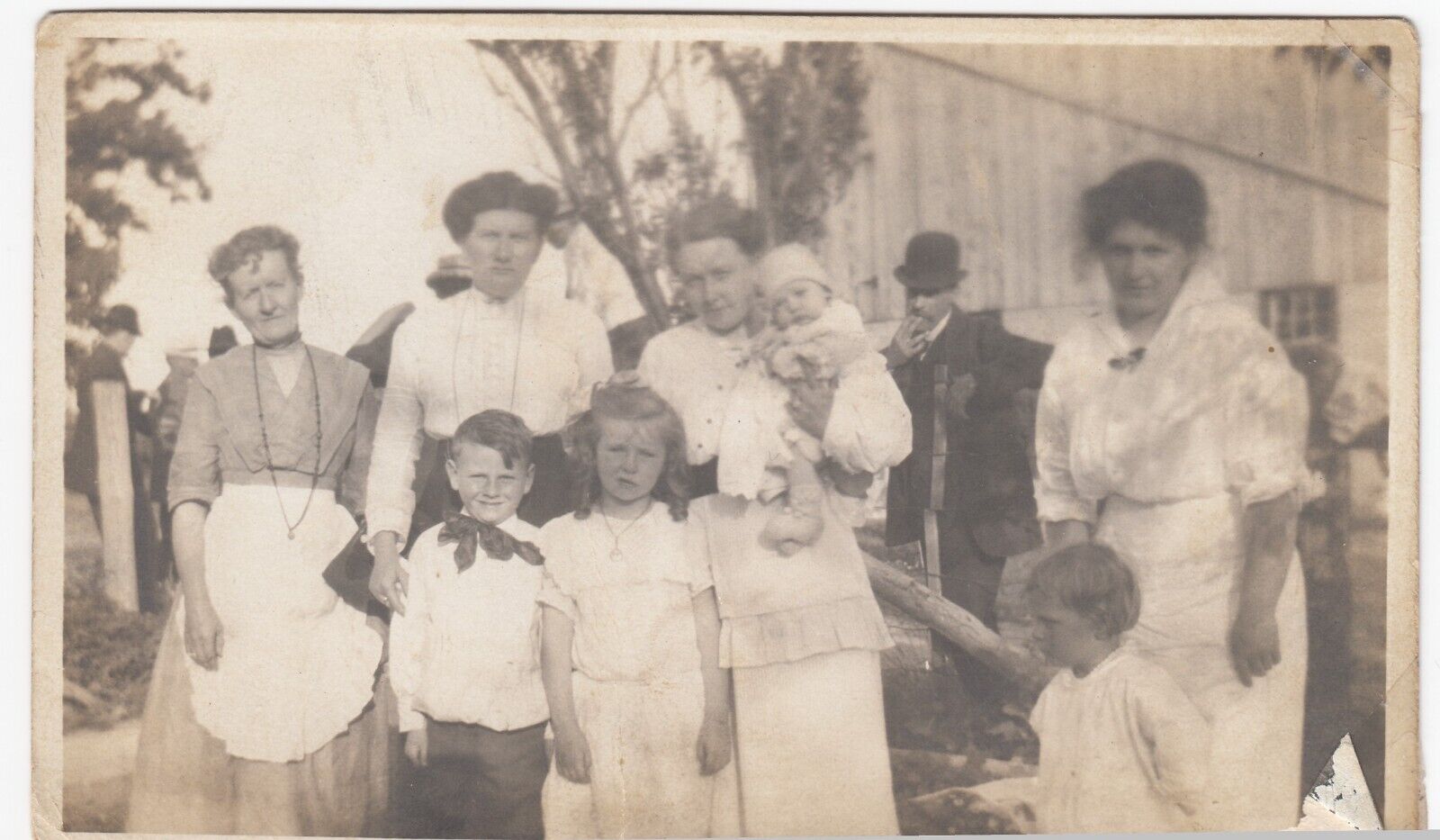 Large Family Gathering (women, children, man), c1915 RPPC Real Photo Postcard