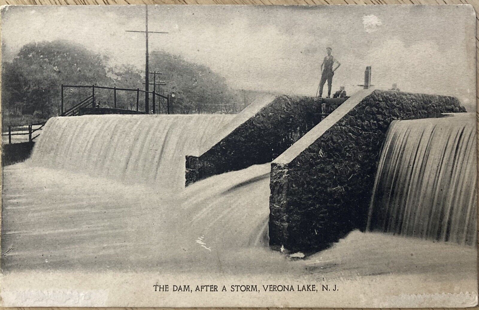 VERONA LAKE, NJ. C.1906 P.C.(A68)~VIEW OF MAN STANDING ON DAM AFTER A STORM
