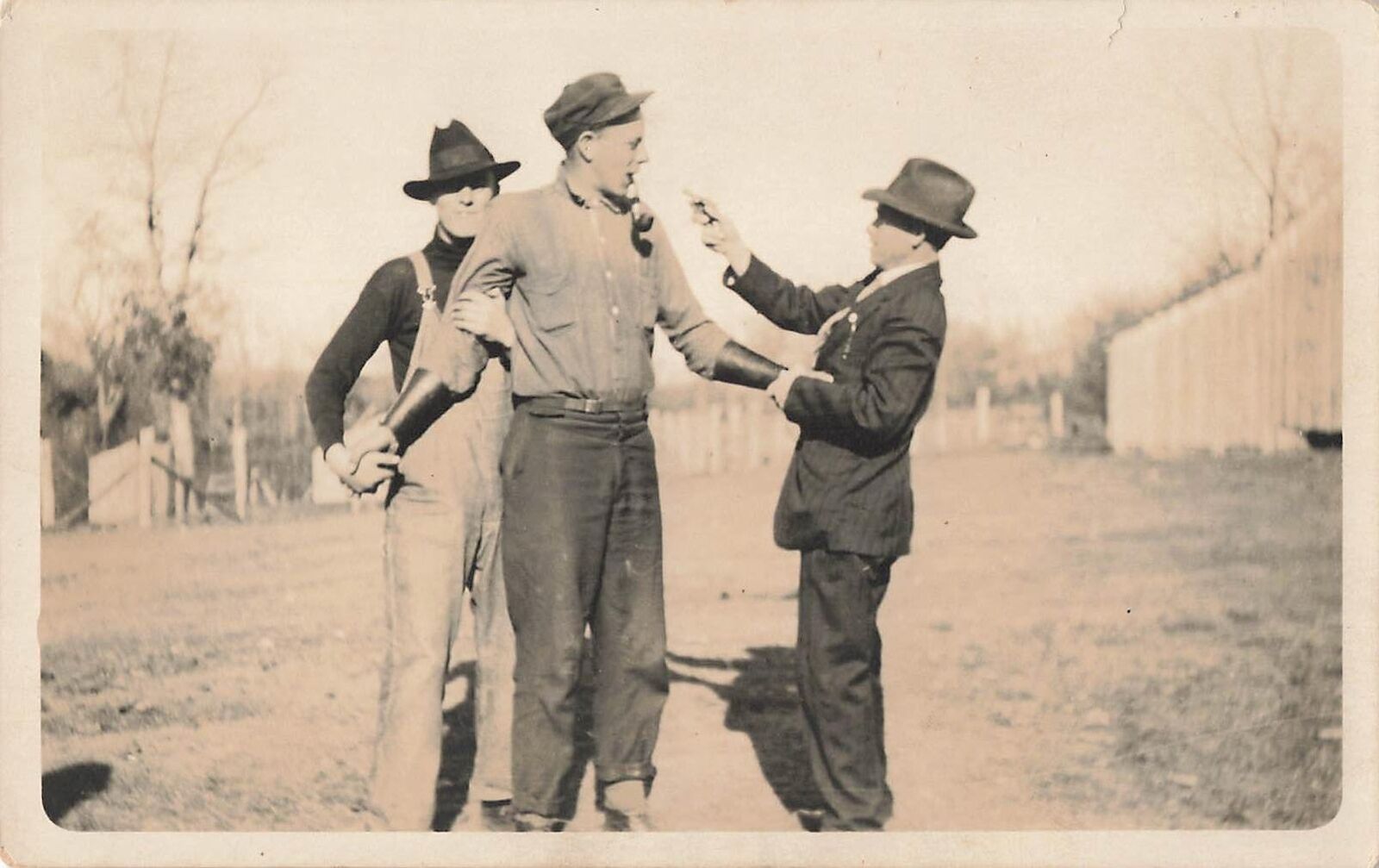Vintage RPPC 1920s Staged Stick Up Scene Man w/ Gun Pipe Criminal Photo Postcard