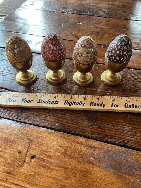 Four Very Decorative Eggs with Brass Holders