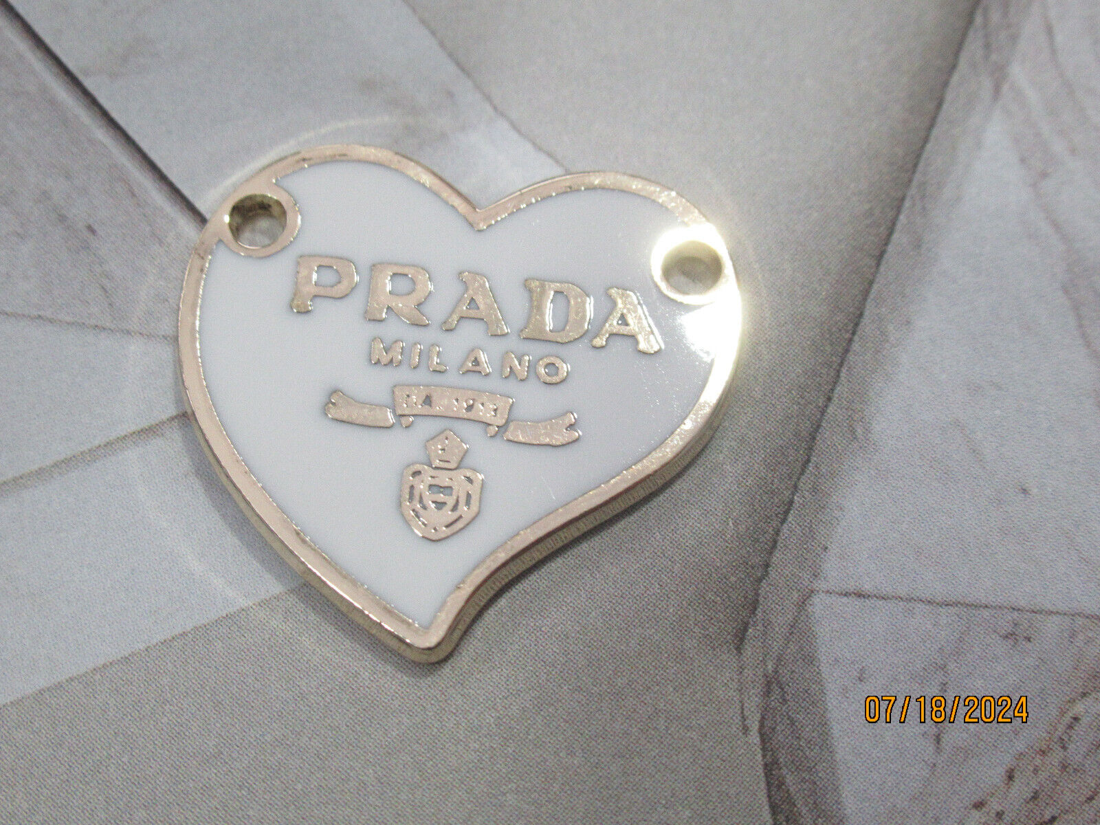 PRADA   CHARM GOLD tone metal , white 24X22 MM  LOT 1
